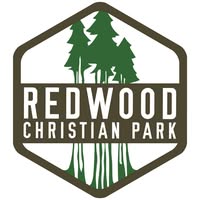 Logo of Redwood Christian Park featuring tall green trees within a hexagonal shape.